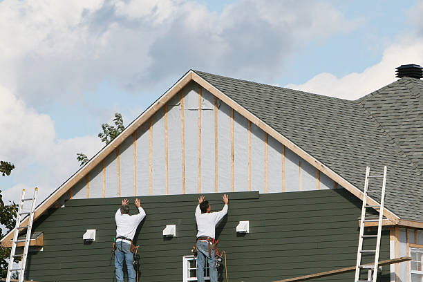 Professional Storm Damage Siding Repair technician working in Nashville, IL